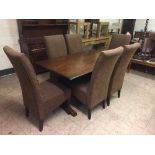 An oak refectory table and six dining chairs