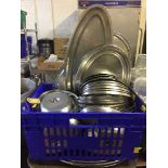 A basket of aluminium food trays and covers