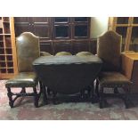 An oak gate leg table and pair of high back chairs