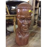 A carved hardwood bust of a man