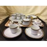 A tray of continental white and gilt tea china,