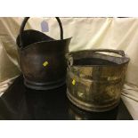 A copper coal bucket and a brass coal bucket