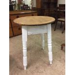 A circular reclaimed pine pub style table