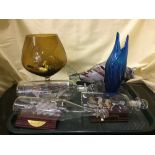 A tray of three ships in bottle, glass fish ornament,