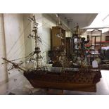 A model of a three masted galleon on stand