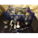 A basket of assorted costume jewellery and a bag of mixed wrist watches