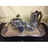 A four piece picquot ware tea service on tray