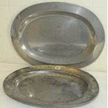 Two antique oval pewter ashets, one with incised initial A to rim (damage to rim), 23¼" & 21" wide,
