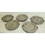 Five antique pewter warming plates of twin handled circular form, some damages, each approx.