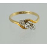 Diamond three stone cross over ring with old cut brilliants & fluted shoulders, '18ct plat',