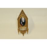 19th century French gilt metal Holy Water stoup, the rectangular back with peaked Gothic pediment,