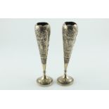 Pair of Indian embossed silver vases of slender tulip shape, 8½ oz.