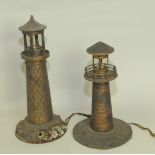 Two early 20th century cast metal table lights, each in the form of a lighthouse, 16" & 13".