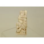 19th century Oriental carved ivory figure of Jurojin in the form of a bearded old man with staff,