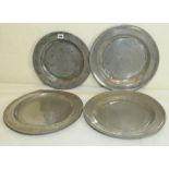 Four antique pewter chargers, impressed with various marks, some splitting / damages,