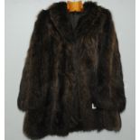 Vintage mid thigh length fur coat, probably brown wolf, no label. Approx. size 14.