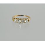 Diamond half hoop ring with four old cut brilliants each approx. .2ct, in gold, c.1900, size P.
