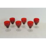 Set of six wine glasses, the ruby ogee bowls on short clear baluster stem & circular foot,