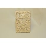 19th century Chinese ivory card case of rectangular form profusely carved with figures & pavilions