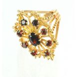 Dress ring with nine garnets in 9ct gold.