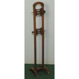 Antique oak wool winding stand with two spindle bobbins, 41" high.