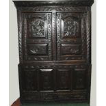 17th century oak press cupboard, carved overall with geometric & foliate designs,