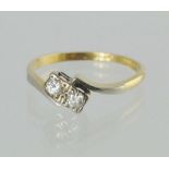 Diamond two stone crossover ring, '18ct & Pt', size Q.