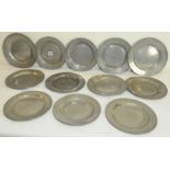 Twelve antique pewter plates of circular form with various impressed marks for mainly London,