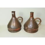 Pair of 2 gallon copper harvest jugs of conical form with single scroll handle, impressed marks,