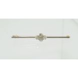 Bar brooch with four & cut diamond brilliants in gold fronted with platinum, '15ct'.