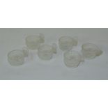 Set of six clear glass salts of single handled circular form with diamond & prism cut banding,