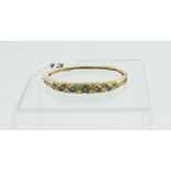 Victorian gold bangle with seven sapphires & diamonds in engraved gold mount.