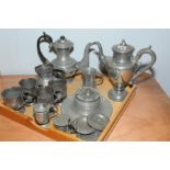 Twelve items of antique pewter including: two coffee pots; inkwell; mustard pots;