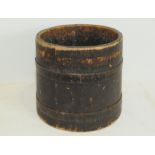Stained wooden coal or log bucket of tapered cylindrical form with coopered banding, 11¼" high.