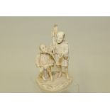 Japanese Meiji period carved ivory okimono of two farm workers having lunch, unsigned, 5¾2 high.