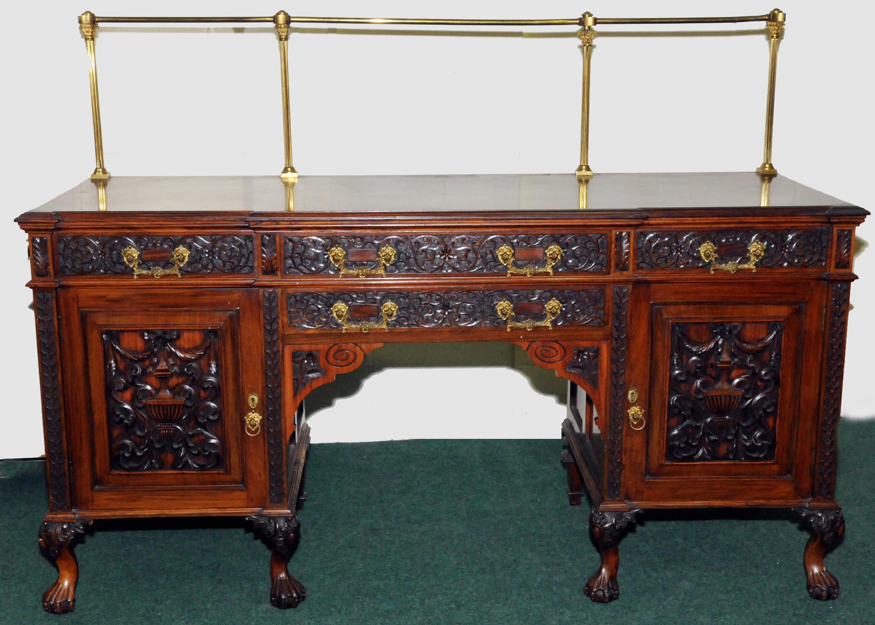 Handsome late 19th century Anglo-Indian rosewood sideboard with brass rail back above breakfront