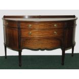 Edwardian mahogany sideboard of demi-lune form,