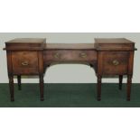 William IV mahogany breakfront sideboard with stepped platform top above central drawer flanked by