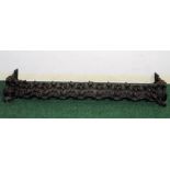 19th century cast iron fender with pierced foliate decoration, 47½" wide.