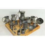 Collection of various items of antique pewter, including: a tappit hen; various mugs; measures;