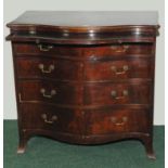 19th century mahogany serpentine form chest in the Georgian style, the moulded edge top above