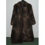 Vintage mid calf length fur coat, probably nutria or coypu, with embroidered maker's name Berger,
