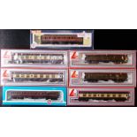 Seven various carriages & rolling stock. Boxed.