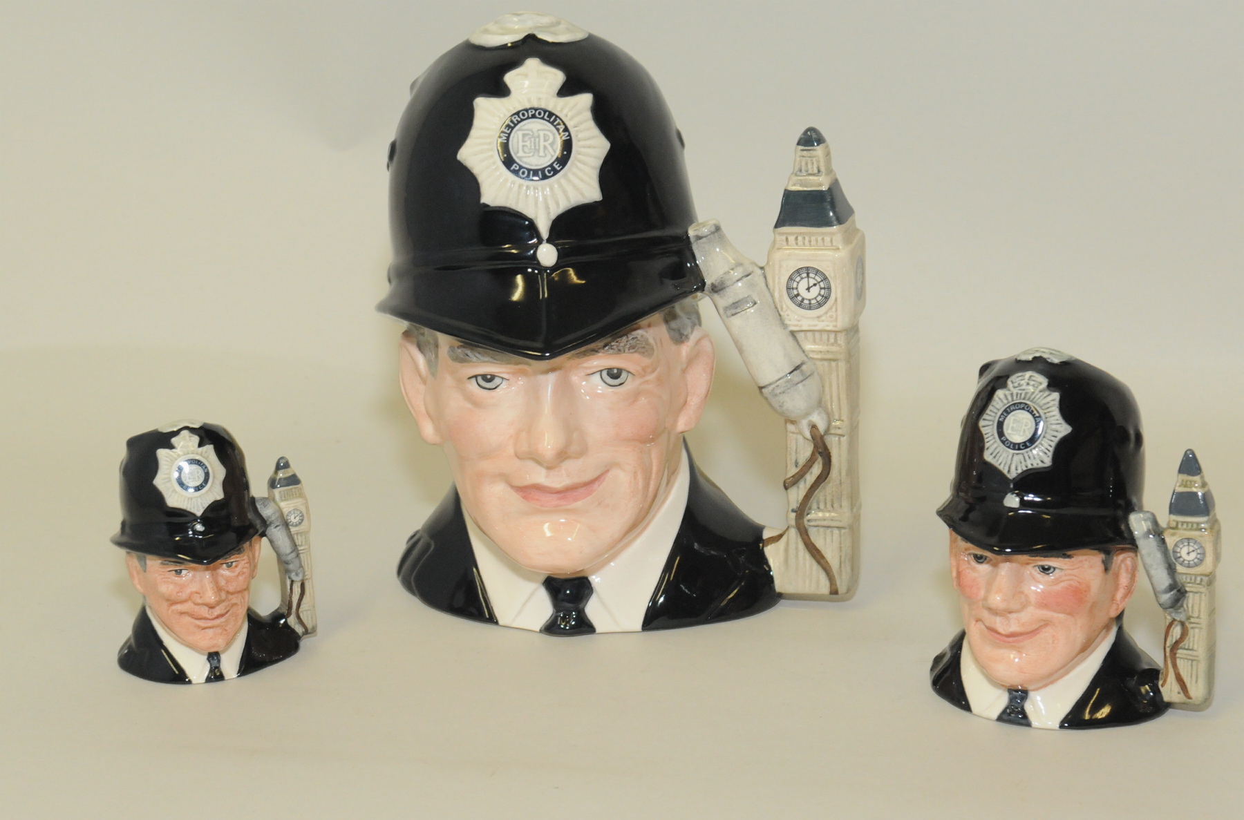 Set of three Royal Doulton character jugs: "The London Bobby", D6744, 7" high; D6762,