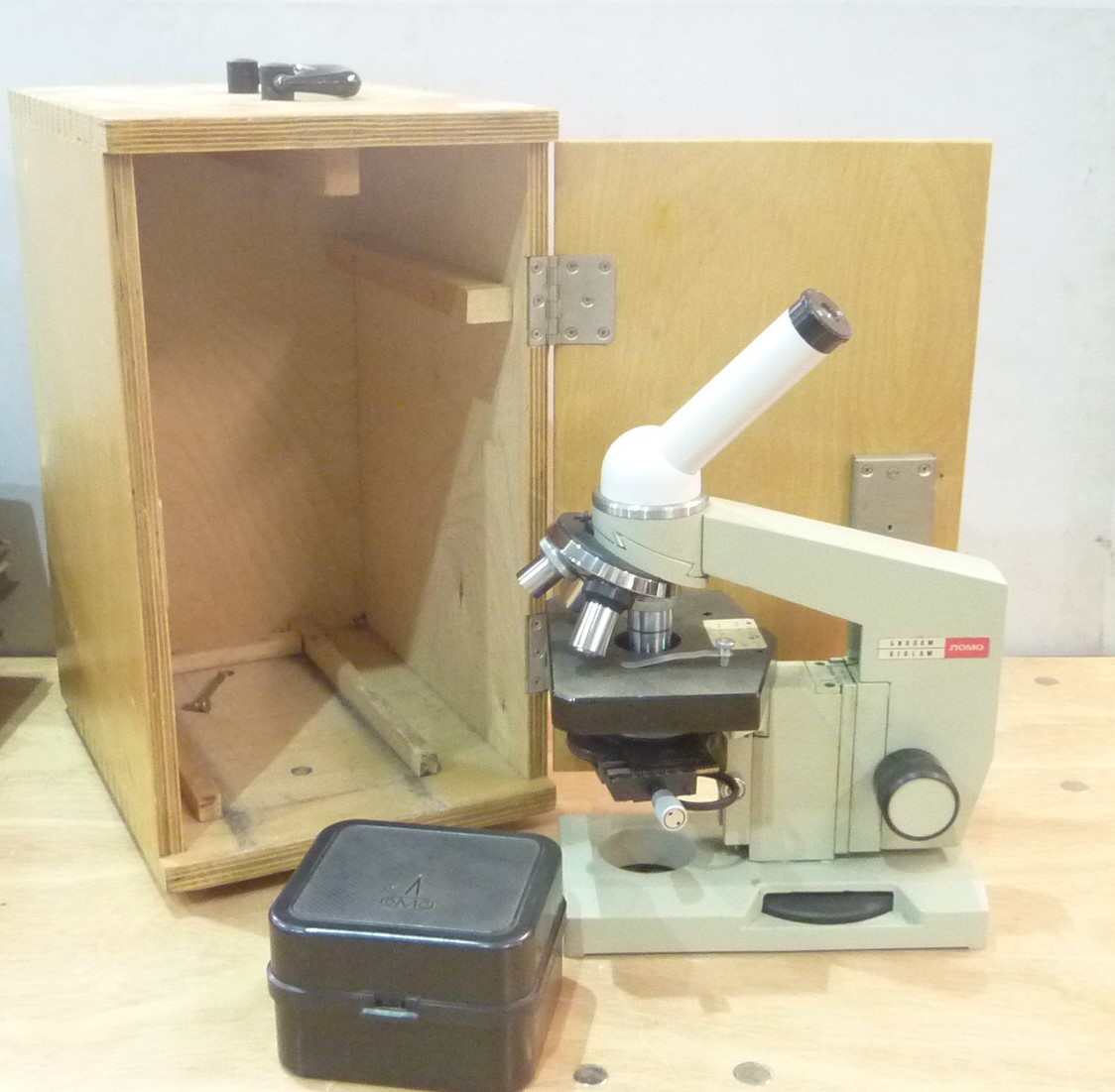 Russian OMO laboratory/school microscope with fine tuning, small box of lenses & bulb in case.