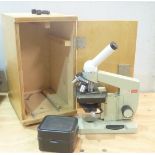 Russian OMO laboratory/school microscope with fine tuning, small box of lenses & bulb in case.