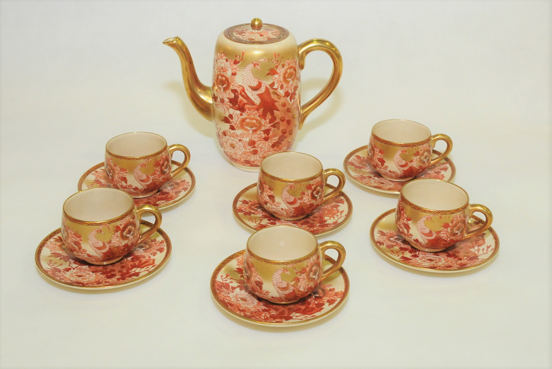 Early 20th century Japanese Satsuma coffee set decorated with peacocks amongst flowers & foliage in