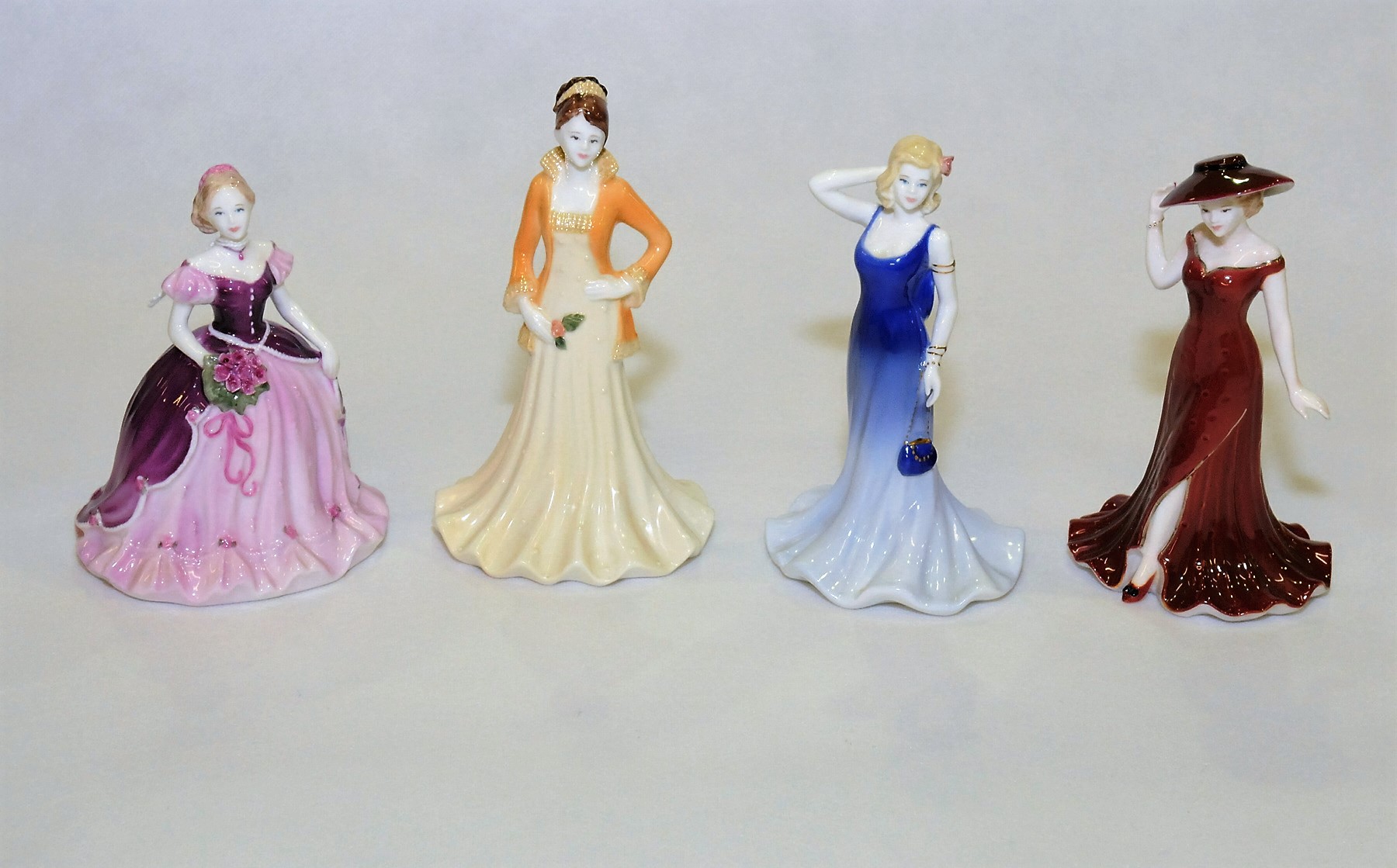 Four Coalport Debutante figures: "Marianne", 5¼" high; "Trisha", 6¼" high; "Paula",