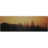 Modern photographic canvas of a Continental skyline with cathedral at sunset, 16" x 47¼".