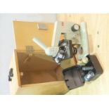 Russian OMO laboratory/school microscope with fine tuning, small box of lenses & bulb in case.